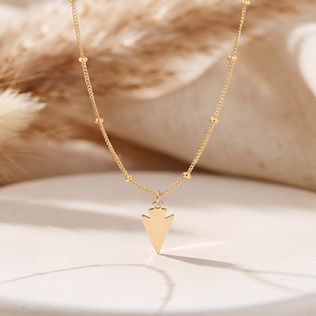 Notched Arrowhead Charm Necklace