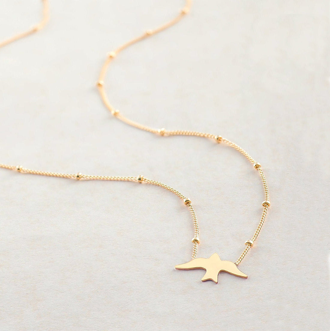 Dove Silhouette Pendant Beady Necklace