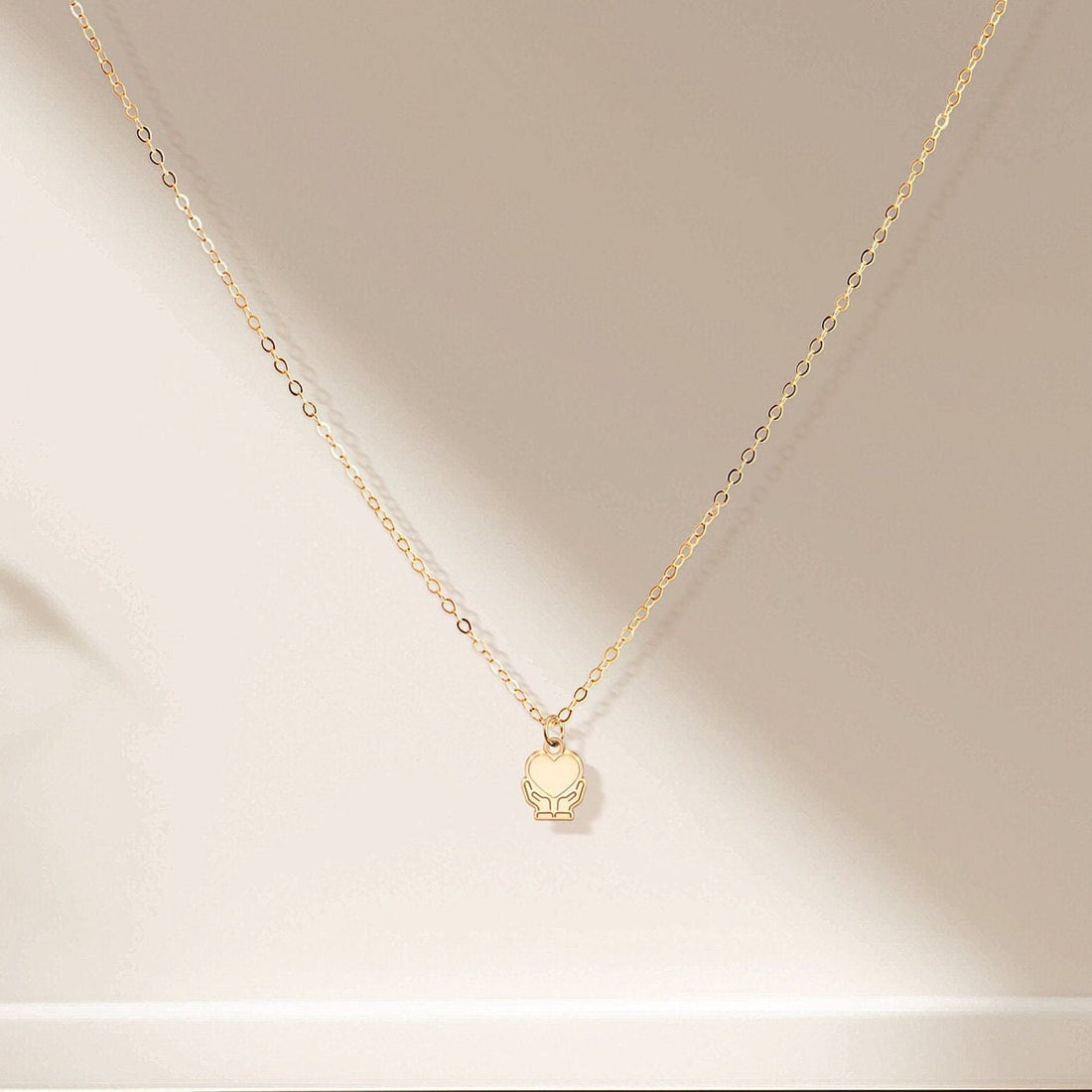 Heart In Hands Necklace