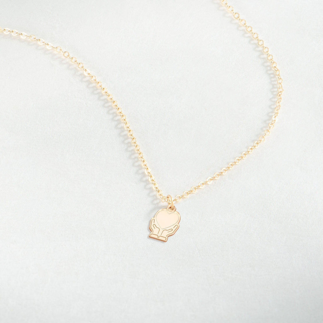 Heart In Hands Necklace