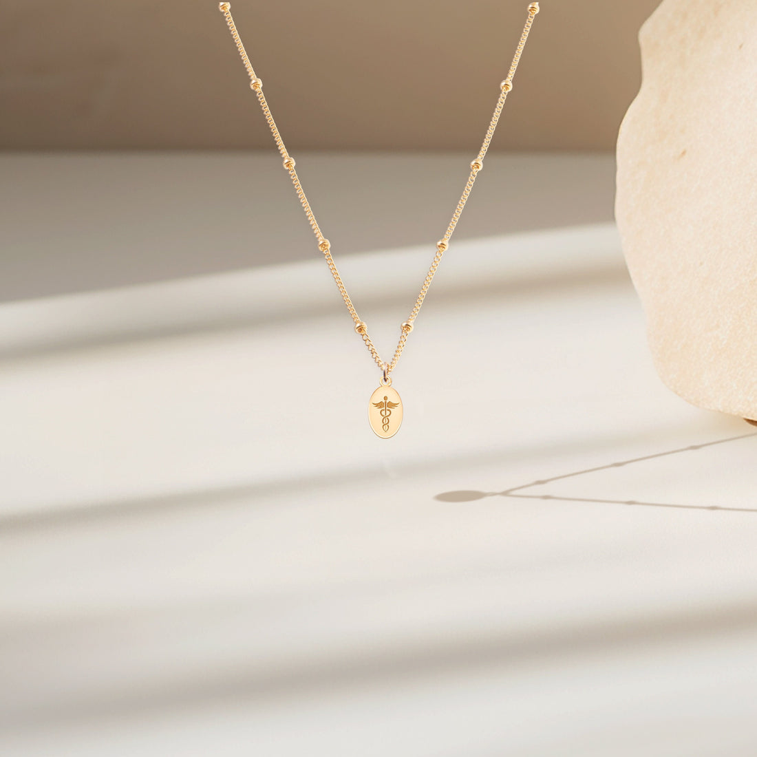Caduceus Oval Disc Necklace