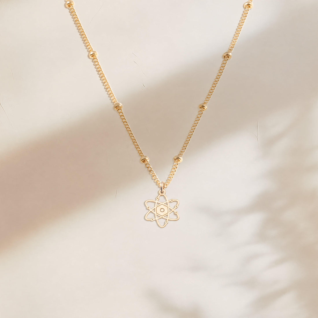 Atom Symbol Charm Necklace