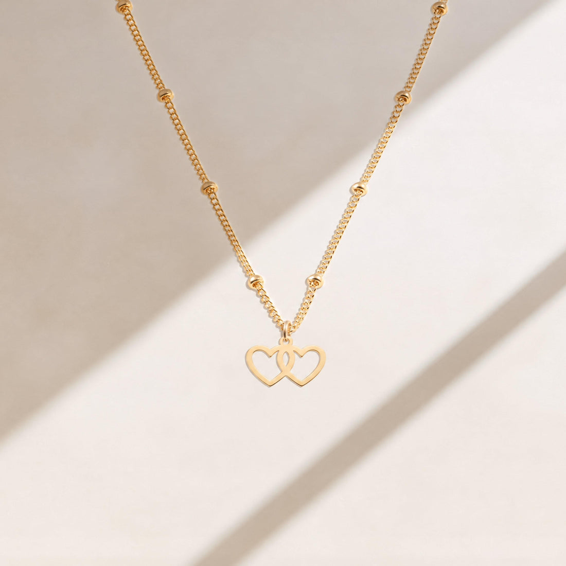 Interlocking Hearts Charm Necklace